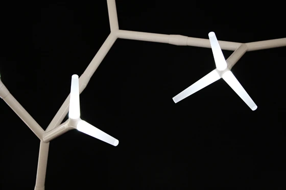 Daniel Becker’s highly graphic ‘Sparks’ modular lighting system for <b>Quasar</b>, with its two-and three-pronged LED lighting elements, is infinitely configurable, creating a striking spatial intervention