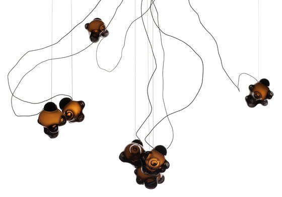 The new ’57 Series’ <b>Bocci</b> continues Omer Arbel’s exploration of form determined by process. Trapping different amounts and configurations of air in a glass matrix produces unique forms, which when illuminated, become even more detailed