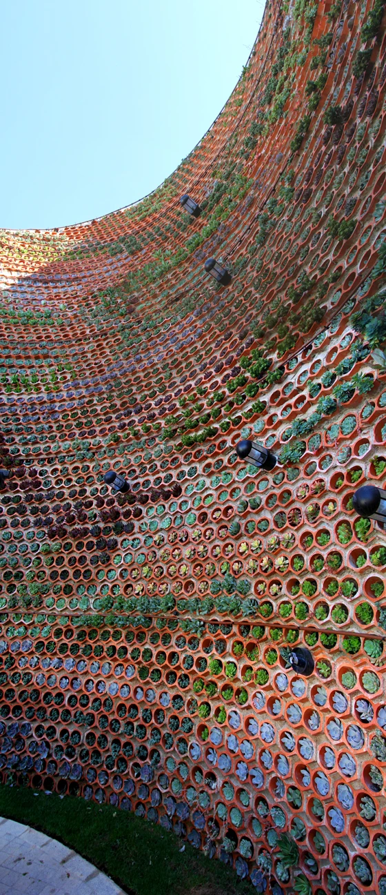 Designed by Spanish architects-cum-landscape architects Urbanarbolismo, this ceramic wall, which doubles as a vertical garden, soundproofs a restaurant in Ushuaïa Ibiza Beach hotel from its adjacent, open-air nightclub