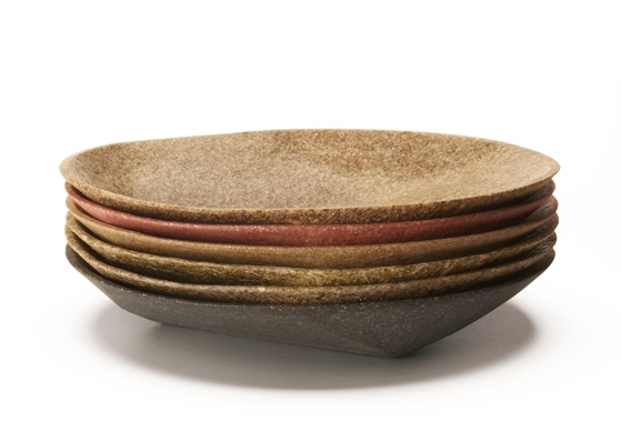 Karrer's award-winning 'FS Stool', whose wooden legs are inserted into the Fluid Solids seat during moulding, dispensing with the need for glue and screws, and his 'FS bowl', which is akin to wood in terms of touch, but possesses the fluid form of plastic