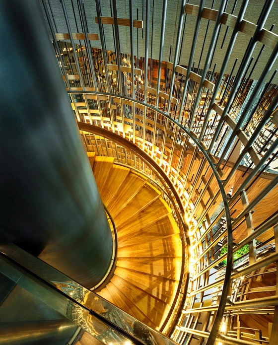 An ornate staircase connects the ground and second floors in WOHA’s glamorous hotel-cum-office, Parkroyal on Pickering, in Singapore; photo Patrick Bingham-Hall