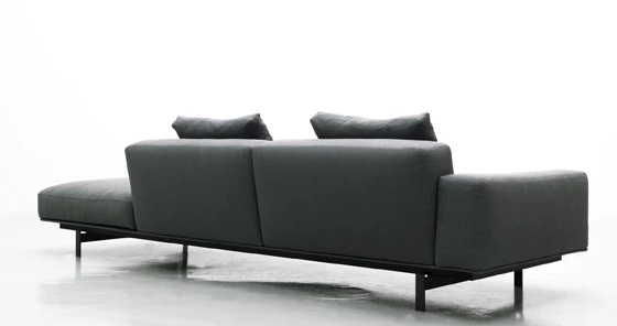 A fabric-covered surface supports the back rests, which are slightly inclined to promote relaxed lounging