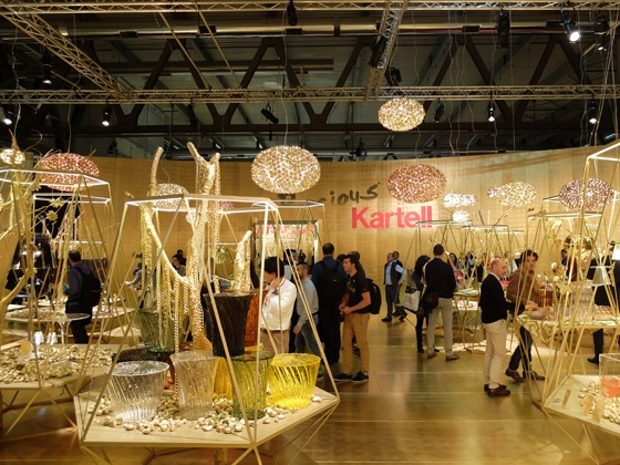 Kartell's stand space at the Milan Furniture Fair, designed by Ferruccio Laviani, takes the form almost of a bazaar, with stall-like plinths presenting visitors with a luxurious edit of its products