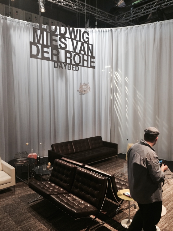 A veil-like, serpentine curtain works it way through the Knoll stand in Milan, defining discrete spaces within the overall footprint