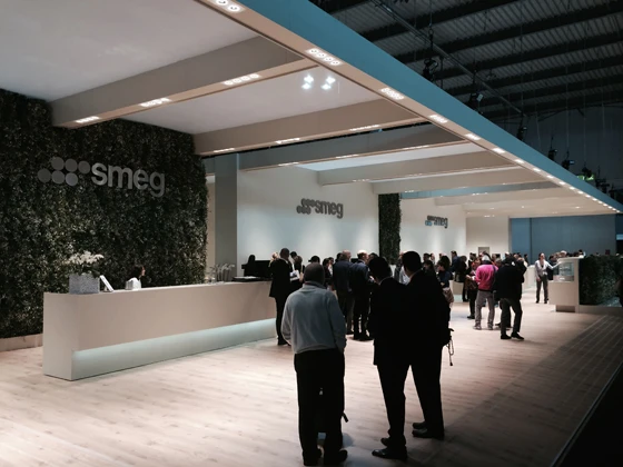 Smeg's ultra-rational fair stand at the Salone's EuroCucina, with imposing cantilevered roof