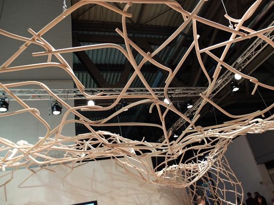 TON's expertise in steam-bending wood is elaborated into a memorable, archly sculptural fair-stand canopy in Milan