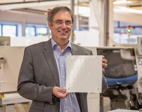 Looking to the future: Managing Director Manfred Diez with one of the LED circuit boards produced on site