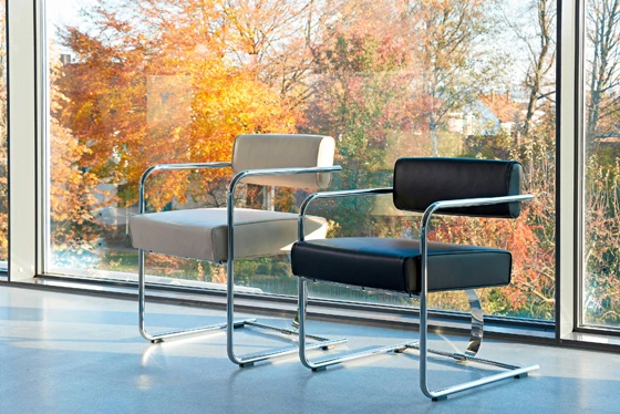 Curves and cantilevers: 'Dining Armchair' (top) and the 'Cantilever Steel Chair' (above)