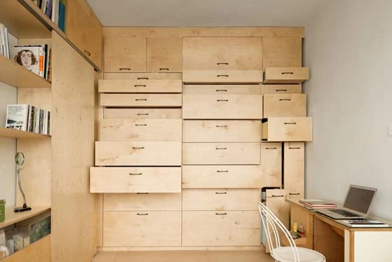 Israeli architect Raanan Stern's modular live-work space, with two desks, 36 drawers, modular storage compartments and a folding bed
