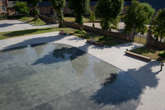 OMGEVING’s similarly serene water feature, which fronts Averbode Abbey near Diest, Belgium, serves another purpose typical of contemporary, urban water features — reflecting architecture, in this case the baroque abbey