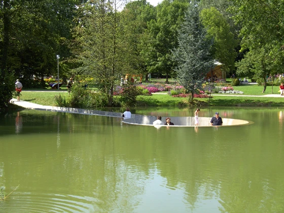 Westpol’s quirky observation deck in the centre of a lake, reached by a ramp, sees the city almost submerged by nature, with visitors surrounded by reflective water and lush woodland