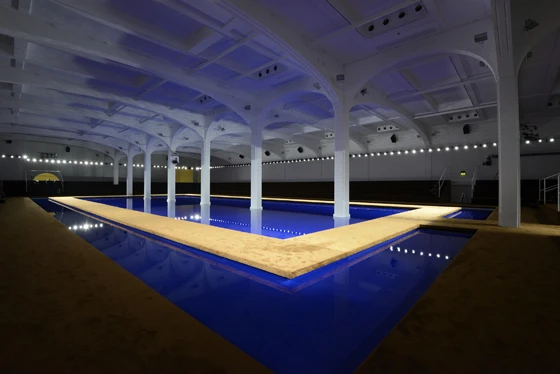 OMA’s surreal runway for Prada’s spring/summer 2015 menswear collection in Milan last June paired a stylised, sapphire-blue pool and a carpeted catwalk in a subterranean, industrial space