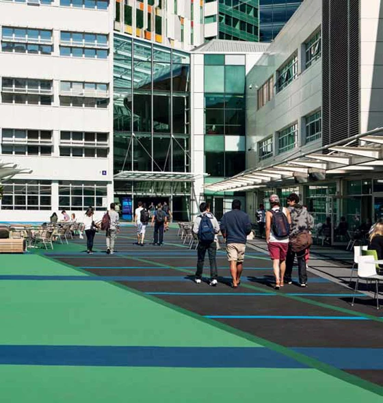 The northern entry into the new atrium sits between two existing campus buildings