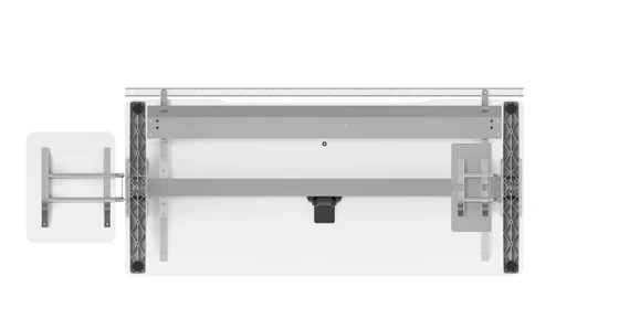 Bottom view with sliding tabletop locking assembly, equipment racks to the side and, beneath the table, cable tray and privacy screen. The primary stabilising structure includes the table legs, the longitudinal beam, and two tabletop mounting rails