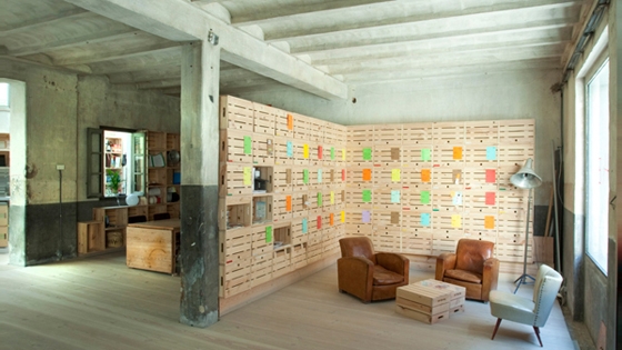Impact Hub Offices in Madrid by ch+qs arquitectos. A co-working space in Madrid with distinctive planks of Danish wood running the full length of the space