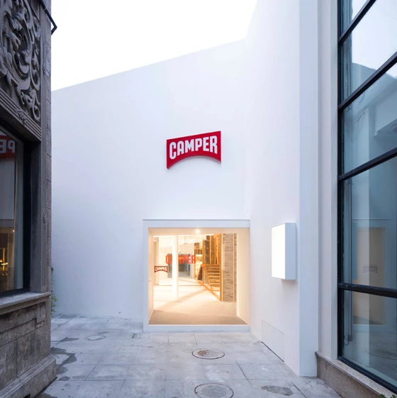One wall of Neri & Hu’s Camper store in Shanghai, featuring references to the city’s traditional alleyways