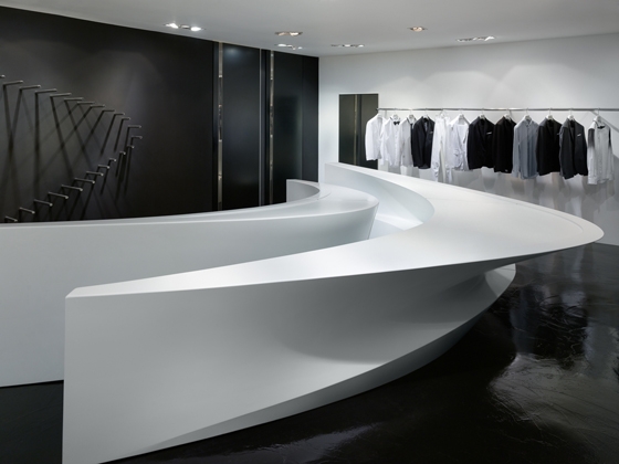 Top and above: Barrett’s boutiques offer an experience that is as much about admiring Hadid’s interiors as it is about appreciating the clothing