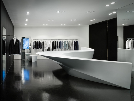 A sinuous, fragmented display system is the focal point of Neil Barrett’s monochromatic, Zaha Hadid-designed fashion boutiques in Seoul and Hong Kong