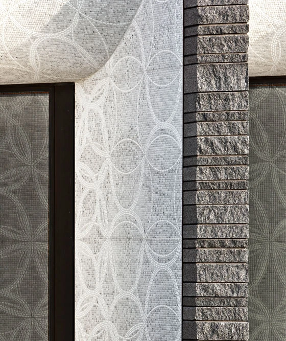 The contrast between the handmade decoration and the rough, split-faced granite was implemented to suggest a threshold between life and the afterlife, photo: Paul Crosby