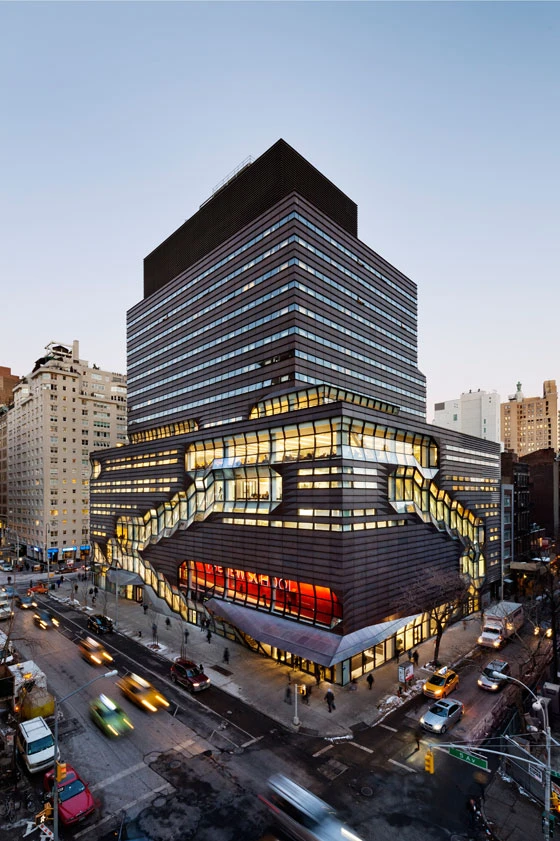 The circulation and common spaces of the SOM-designed university centre in New York appear to wind around the building. From the outside, they are set off visually from the sheet-copper cladding; photo: James Ewing