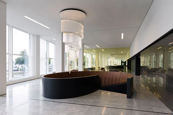 The cylindrical Tooby lamps can be configured to create spectacular bespoke lighting designs, such as this spiralling chandelier produced to be installed above a staircase
