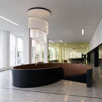 The cylindrical Tooby lamps can be configured to create spectacular bespoke lighting designs, such as this spiralling chandelier produced to be installed above a staircase