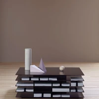 The metallic Millefoglie coffee table was designed by Emanuel Gargano and Anton Cristell and is being presented for the first time at IMM in Cologne this January. Its geometric multi-level suspended appearance was inspired by a millefeuille layered cake