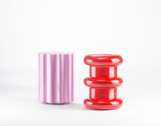 Philippe Starck's Mademoiselle chair (top) is one of a number of Kartell best-sellers to receive the Memphis treatment with a textile designed by Ettore Sottass. Above, Sottsass's new Colonna and Pilastro stools for Kartell