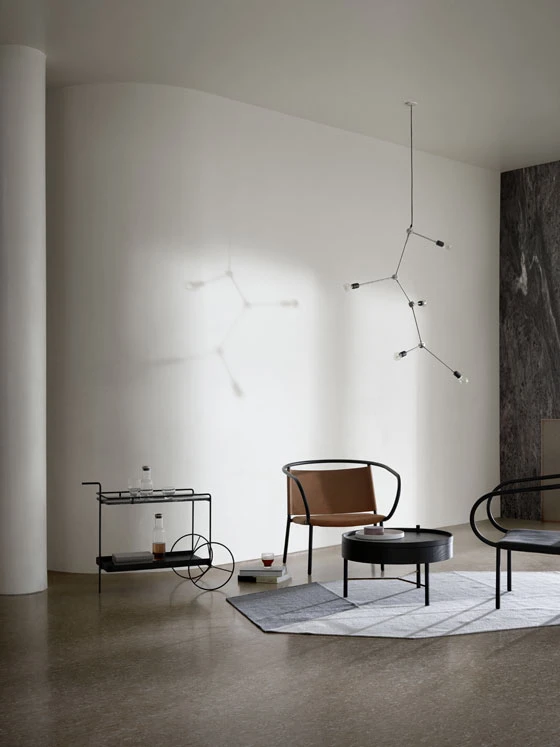 Søren Rose’s 1930s-inspired Harrison chandelier alludes to the same form-follows-function approach as the Afteroom Lounge Chair, which is a contemporary hybrid of Breuer’s Wassily Chair and classic Thonet bentwood