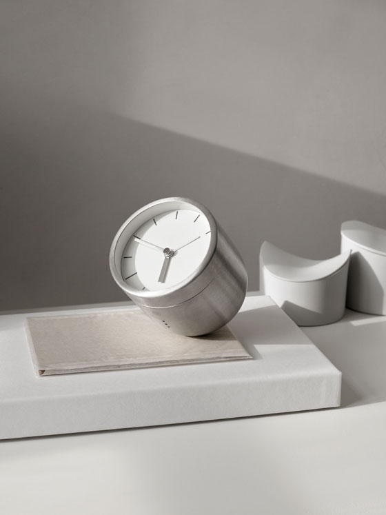 Stick System shelving (top) wears its construction well, the tubular framework reminiscent of functional Bauhaus industrial design. The Norm Tumbler Alarm Clock (above) is weighted to tilt face-up