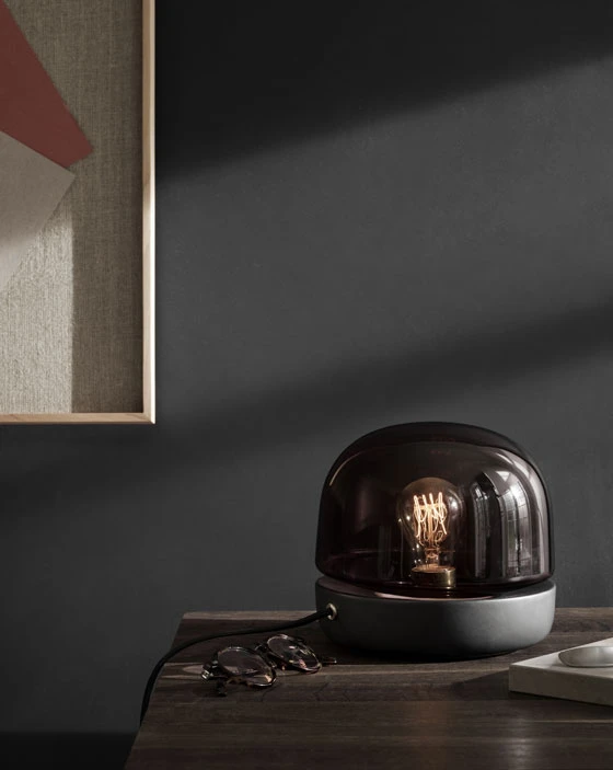 Norm Architect’s Stone lamp (above) embodies the intangible Danish concept of ‘hygge’, with its ceramic base supporting a mouth-blown glass shade that revealing the bulb and emits a glow akin to candlelight