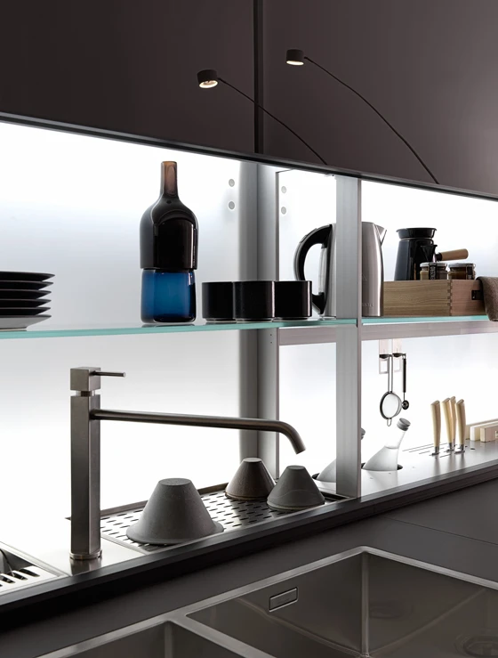 The Riciclantica Inox Touch kitchen features the warmth of wood combined with stainless steel that has been sand-blasted (top); the Genius Loci with the clever Air Logica back panel storage system that makes the best use of extra-deep base units (above)
