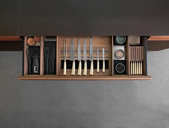 The Genius Loci with a granite counter and worktop in burnished oak featuring an integrated drawer (top); the Genius Loci with copper finish drawers (above)