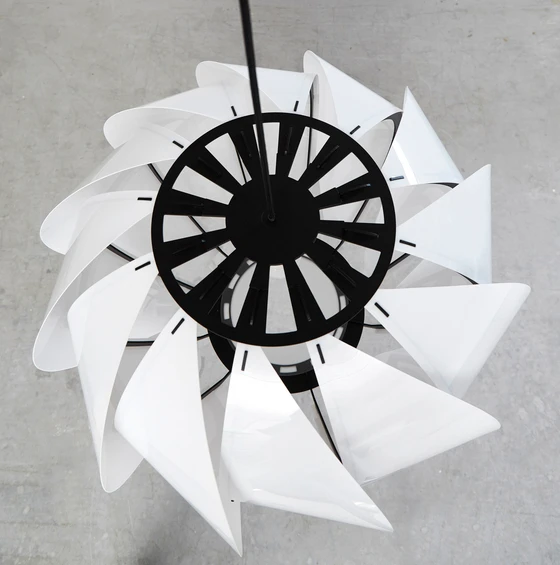 Focal point for the design of Arkiturbine was the asymmetry of a turbine. Its construction, with frame and laser-cut blades, is simple and easy to read, yet the result is surprising in its appearance