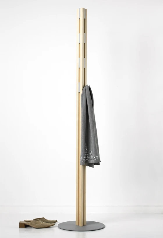 The Knax Hall stand is made from solid wood. Its 12 aluminium hooks sit flush when not in use