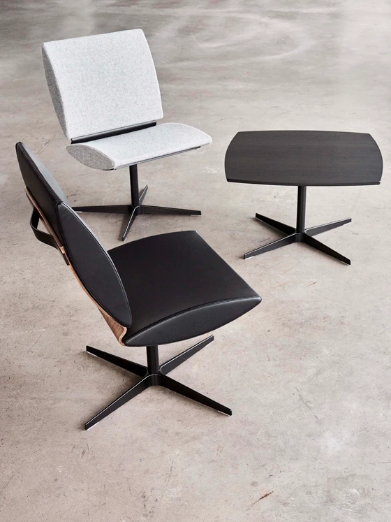 Erik Bagger Furniture’s City chair, which is designed to optimise comfort, and comes with a chrome or wooden base. Shown here, the City table featuring the same style of single leg