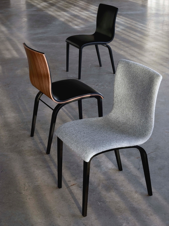 Another view of the elegant City lounge chair whose backrests are cradled by curved panels of wood (top); the simple Jazz table rests on three tapering legs (middle); illustrating the company's predeliction for gentle curves: the Copenhagen chair (above)