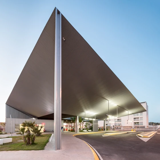 Bus station as landmark in Santa Pola, Spain, thanks to its dramatic, tapering metal canopy, designed by architects Manuel Lillo and Emilio Vicedo. Photos: Filippo Poli