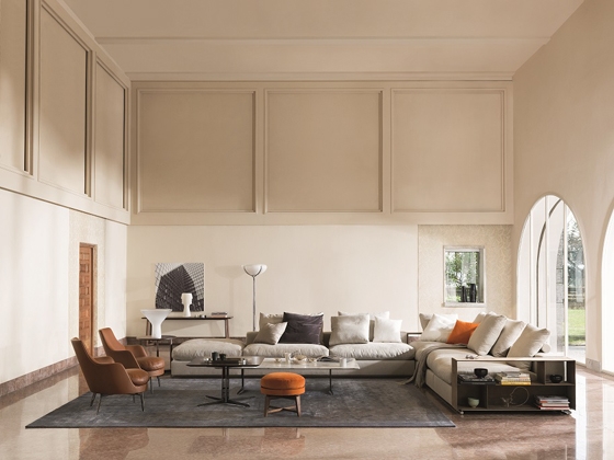 The metal storage units embody clean lines and rigidity but are soft to touch. Multi-functional, they operate in combination with the sofas as armrests, backrests, bookshelves, or as additional surfaces for work or leisure activities