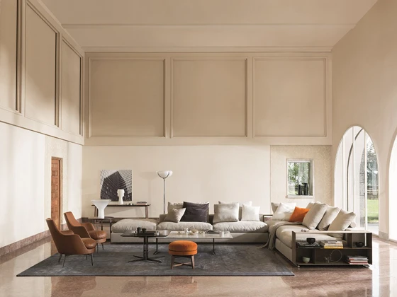 The metal storage units embody clean lines and rigidity but are soft to touch. Multi-functional, they operate in combination with the sofas as armrests, backrests, bookshelves, or as additional surfaces for work or leisure activities