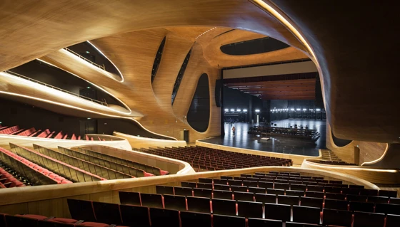 The dramatic, curvilinear, aluminium-clad form of Beijing office MAD Architects’ opera house in the Northern Chinese city of Harbin houses, cocoon-like, an ash-panelled, 1600-seater auditorium, a smaller theatre, and a public plaza; Photos: I. Baan