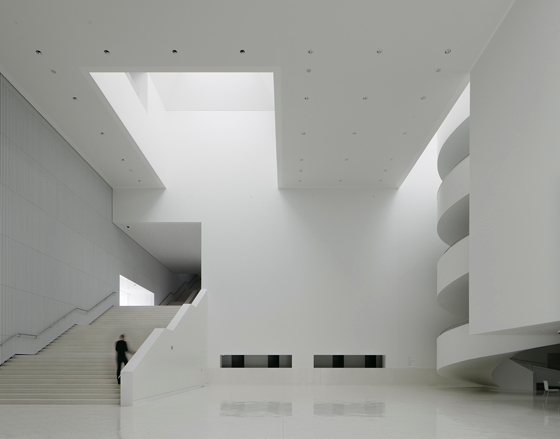 Articulated externally as a concatenation of gabled volumes, Spanish practice Barozzi Veiga’s Szczecin Philharmonic Hall in Poland underscores its eschewal of the monolithic with its backlit glass-ribbed facadet; Photos: Menges, Hufton + Crow