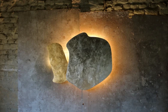 Top and above: Nature is a big influence on Rabii’s unpredictable designs. This is particularly evident in her Yaya lights with their organic forms. Golden indirect light emanates from their irregular edges