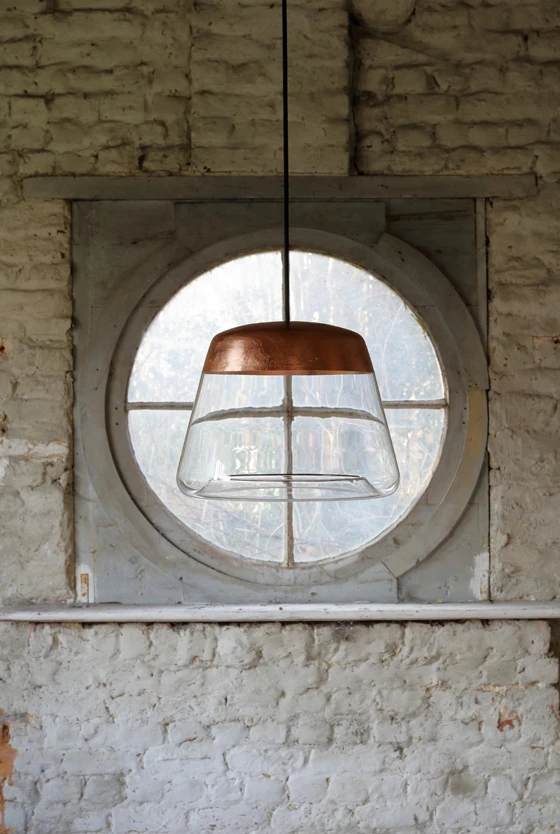 Both rich-looking and ethereal, Hind Rabii’s Ice Absolute light juxtaposes transparent glass with a band of copper, counterbalancing opacity with transparency