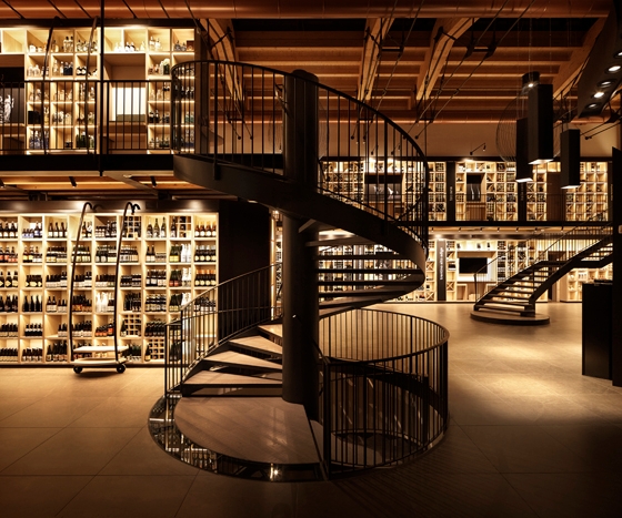 Top: Lighting design helped transform this Blenheim Palace interior into a space of retail discovery. Above: LLG's team was instrumental in giving the warehouse-like Ferrowine wine store bright shelves but a cozy shop