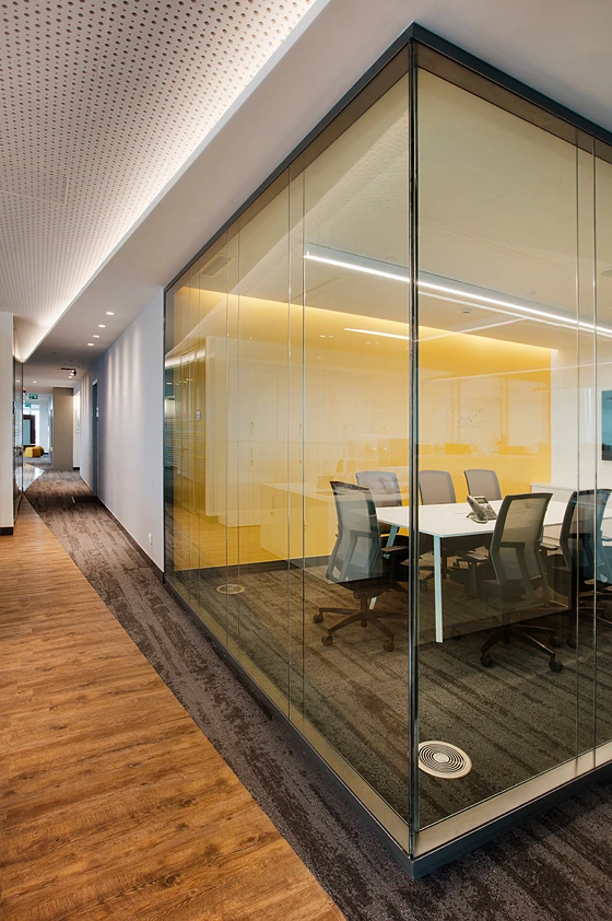 This lounge area features a variety of seating options including the Alava chair designed by Stefan Brodbeck (top). The Me Too chair is highly adjustable, allowing work to be carried out in comfort. They are used in the more formal meeting rooms (above)