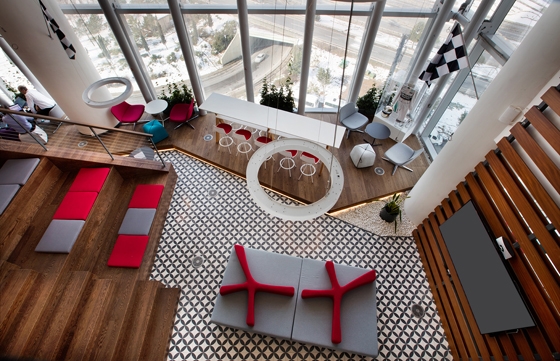 Each floor is themed with a strong colour palette – green for the games floor, orange for the 'golf' floor and purple for the 'sailing' floor