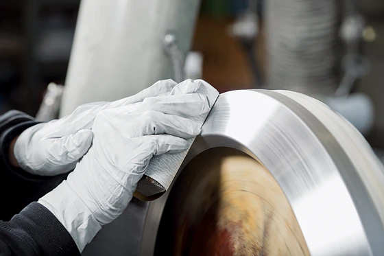 Finishing touches: the Conversio lampshade is hand polished prior to anodising.