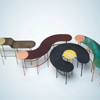 As a group the Scribble series of coffee tables by Francesca Lanzavecchia exhibit the varied palette made possible by exposing copper to different oxidations. Like paint strokes they have playful names such as Dot, Comma, Accent and Bracket