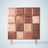 Nika Zupanc’s “cabinet of wishes” showcases three copper finishes in across its collection of square compartments, which each come with a glossy copper key - a recurring motif in Zupanc’s work